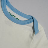 Close up of piping of chambray blue short sleeve onesie