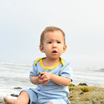 Baby in Blue and Yellow onesie and shorts