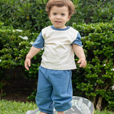 Toddler wearing color block tee white with navy in 100% peruvian pima cotton and french terry navy blue sweatpants