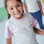 Toddler wearing Arquia Color Block Kids Tshirt white with pink made of 100% Peruvian pima cotton