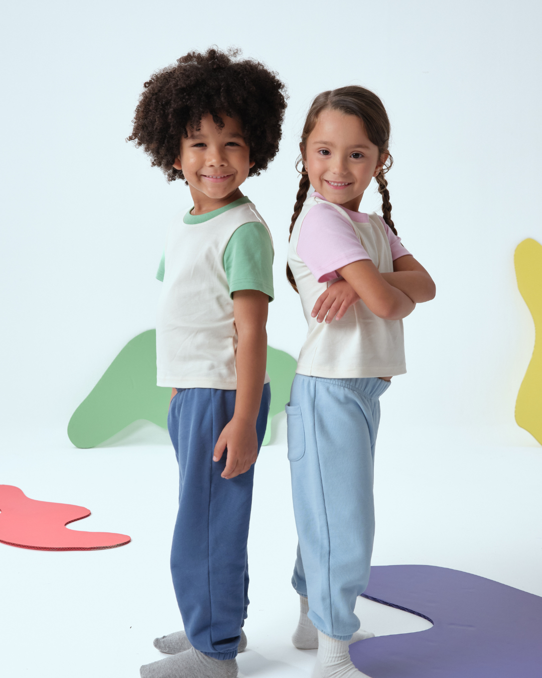 Toddlers wearing Arquia kids color block tshirt white with pink and white with green 