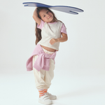 Toddler wearing White with Pink Color Block Tshirt and white sweatpants