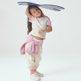 Toddler wearing White with Pink Color Block Tshirt and white sweatpants