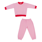 Pink | Pink children's pajama set with red trim on a white background