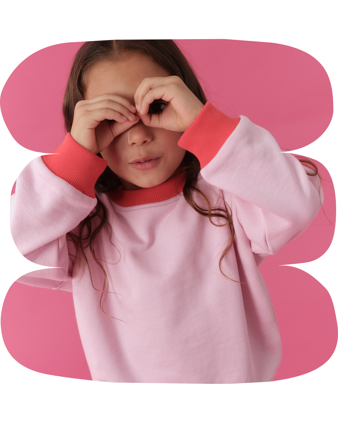 Pink | Child wearing a pink and red outfit with a pink background