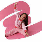 Pink | Child in pink outfit on a large pink letter 'B' with a white swoosh.