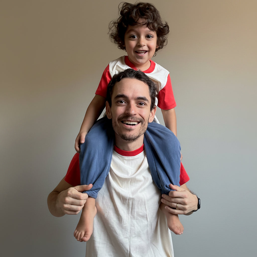 White with Engine Red | Man carrying a child on his shoulders indoors