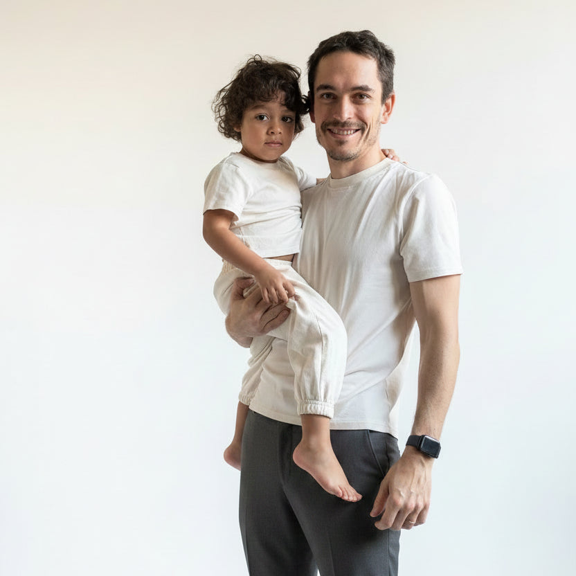 White | Man holding a child in matching outfits