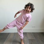 Pink | Child in pink tshirt and sweatpants 