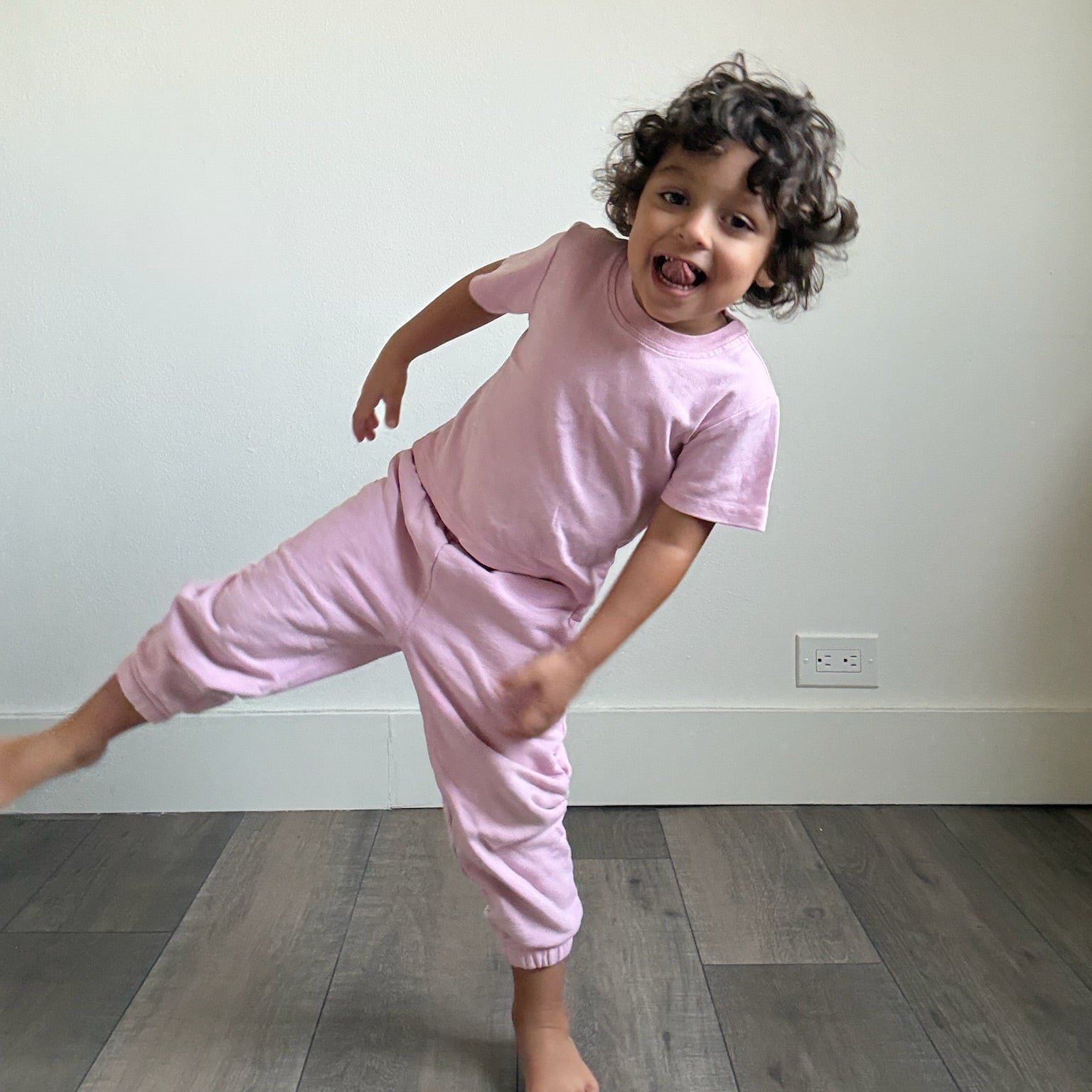 Pink | Child in pink tshirt and sweatpants 