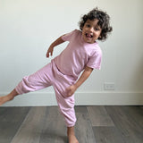 Pink | Child in pink tshirt and sweatpants 