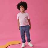 toddler wearing Arquia kids solid pink tshirt and navy blue sweatpants