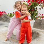 matching siblings in contrast tshirt pink with red and red with pink