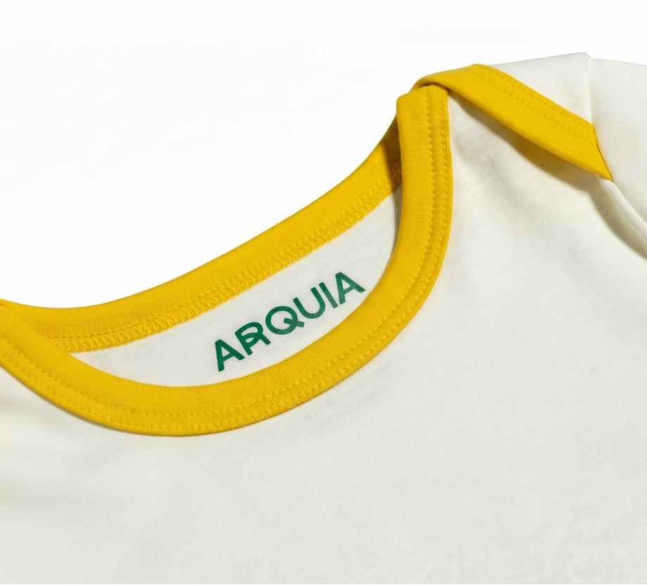 White with Misted Yellow | Arquia Long sleeve baby onesie in Peruvian Pima cotton 