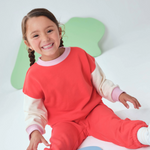 Toddler wearing Arquia red trio sweatshirt and red sweatpants made of premium french terry cotton