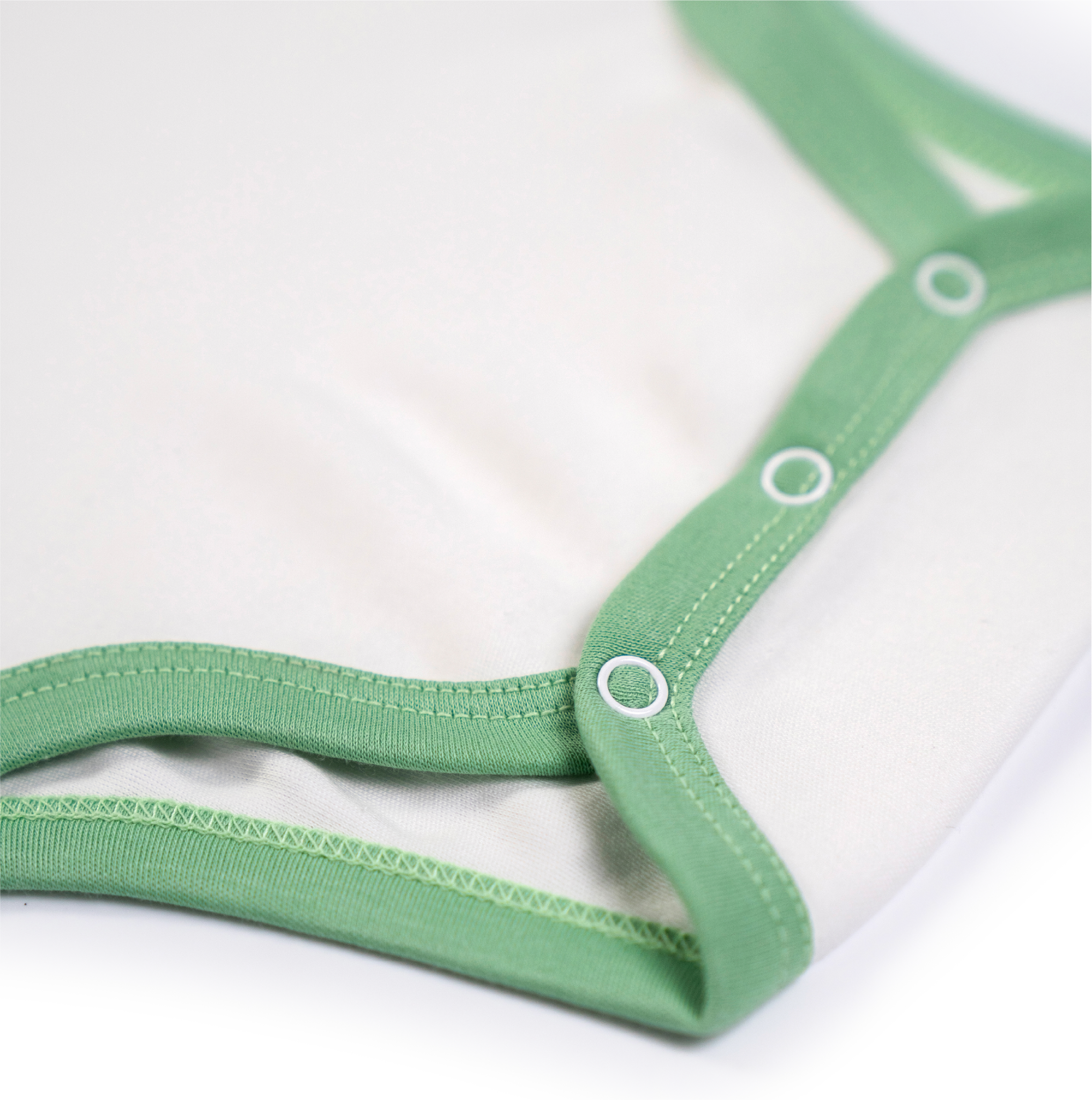 White with Grass Green | Arquia Short sleeve baby onesie in Peruvian Pima cotton