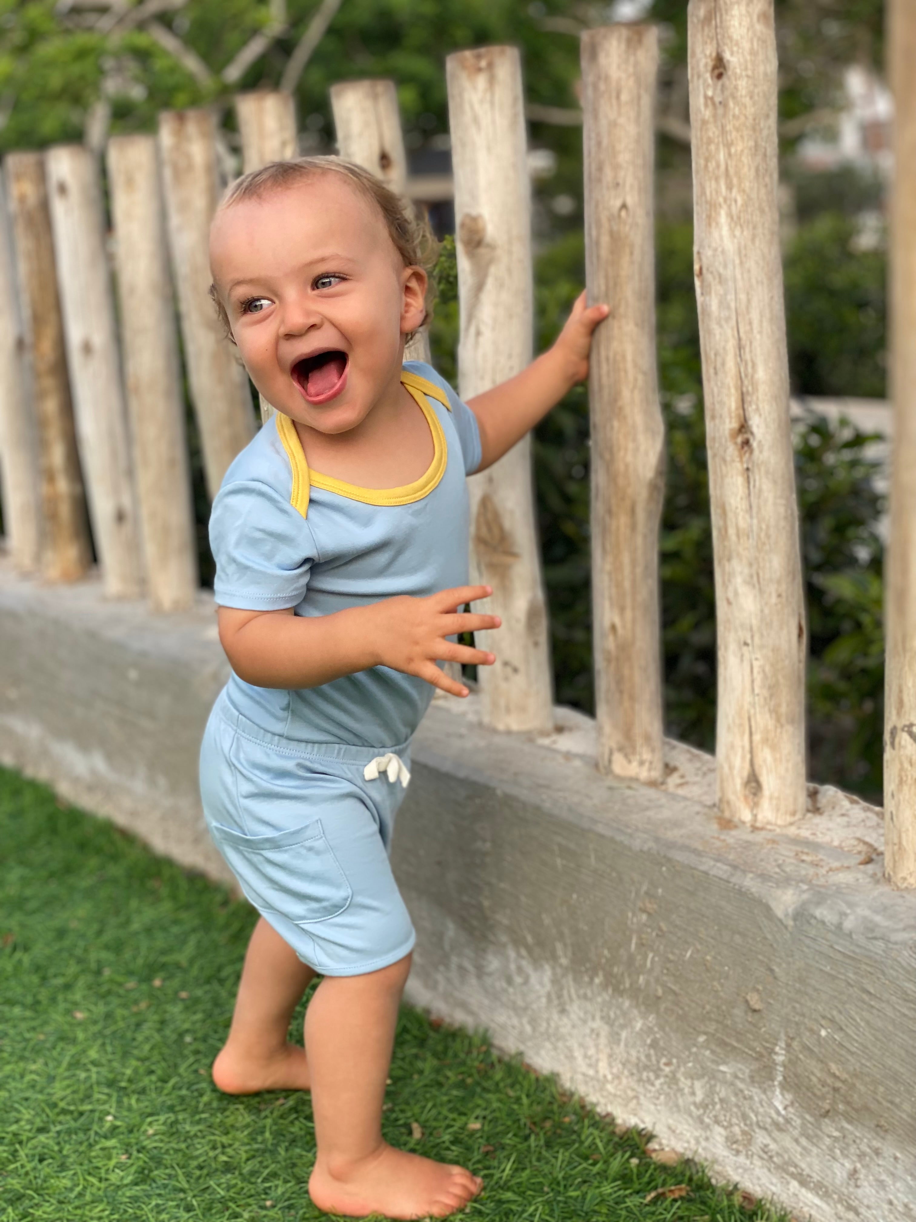 Baby in Sunny day set: short sleeve bodysuit in blue with yellow and shorts