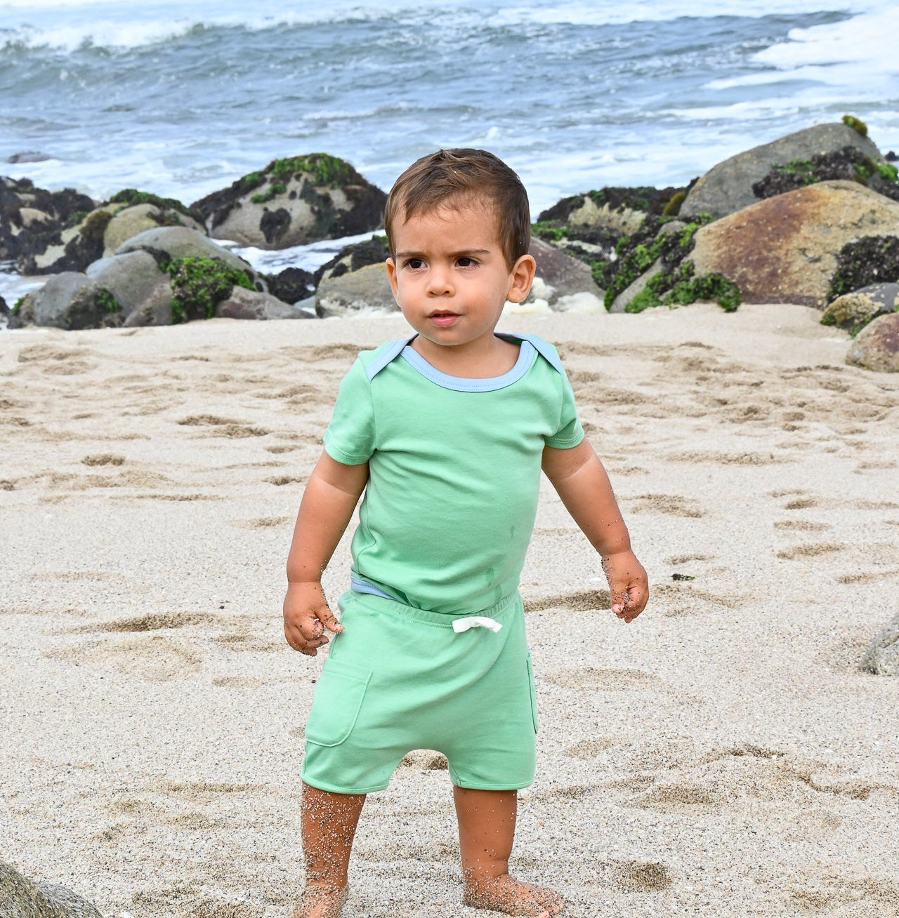 Grass Green with Blue | Baby wearing Sunny Day Set: short sleeve bodysuit in green with blue and green shorts made of 100% peruvian pima cotton