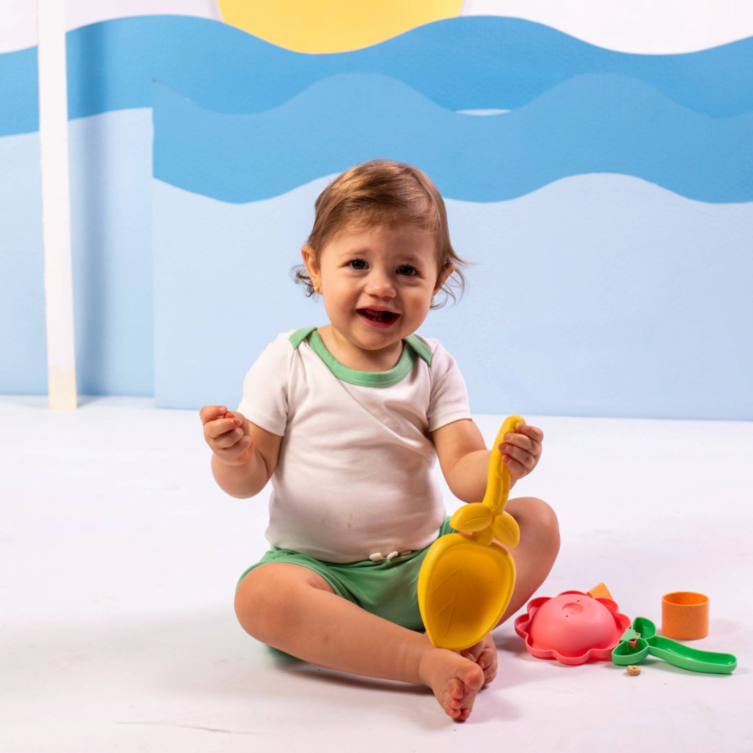 Baby Wearing Short Sleeve Bodysuit and Shorts in White with Green