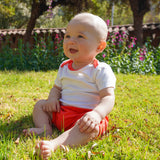 Baby wearing sunny day set: short sleeve bodysuit and shorts in red in 100% peruvian pima cotton