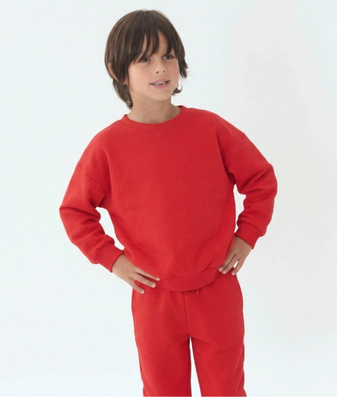 Engine Red | Child wearing a red outfit on a white background